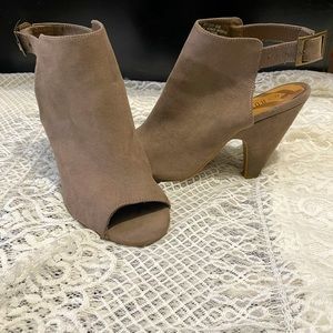 Open toe sling back heels.